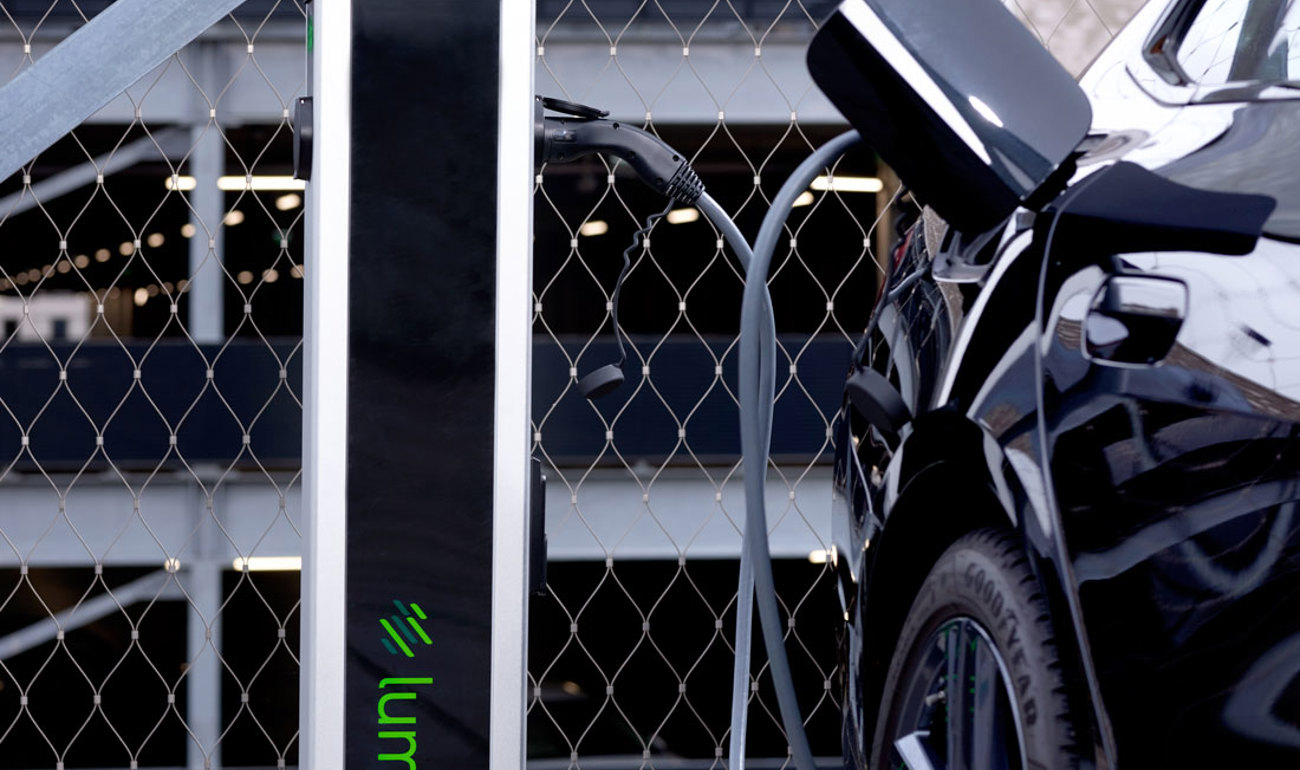 Lumosa TRACK AC charger in parking area