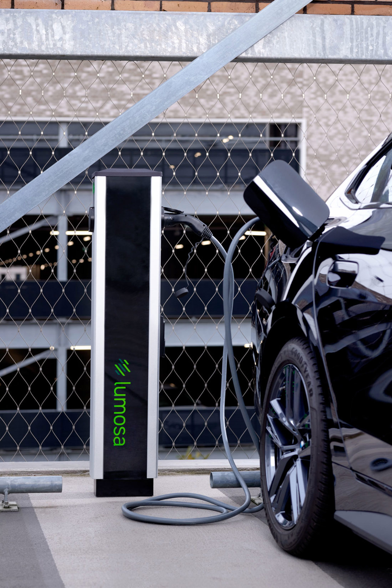 Lumosa TRACK AC charger in parking area