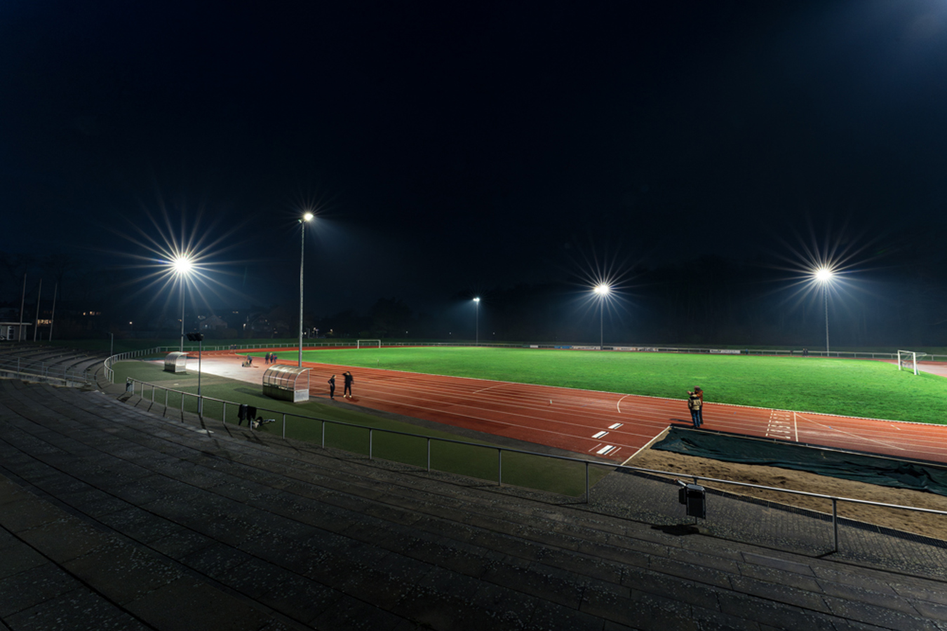 Evening football match at Schlossparkstadion Brühl with bright and uniform Lumosa LED lighting.