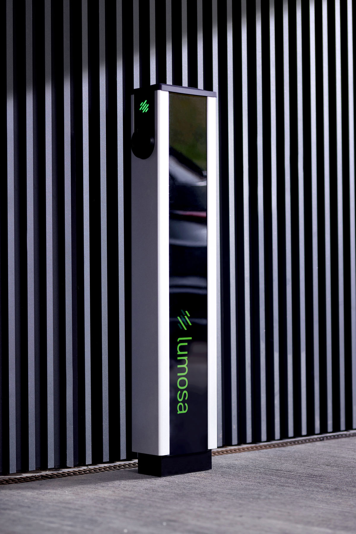 Lumosa TRACK AC charger next to office facade