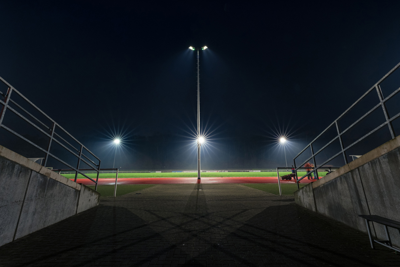 Night view of Schlossparkstadion Brühl with Lumosa LED sports lighting for matches and training sessions.