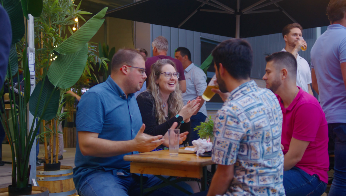 Lumosa employees talking during the opening of the new office in Son